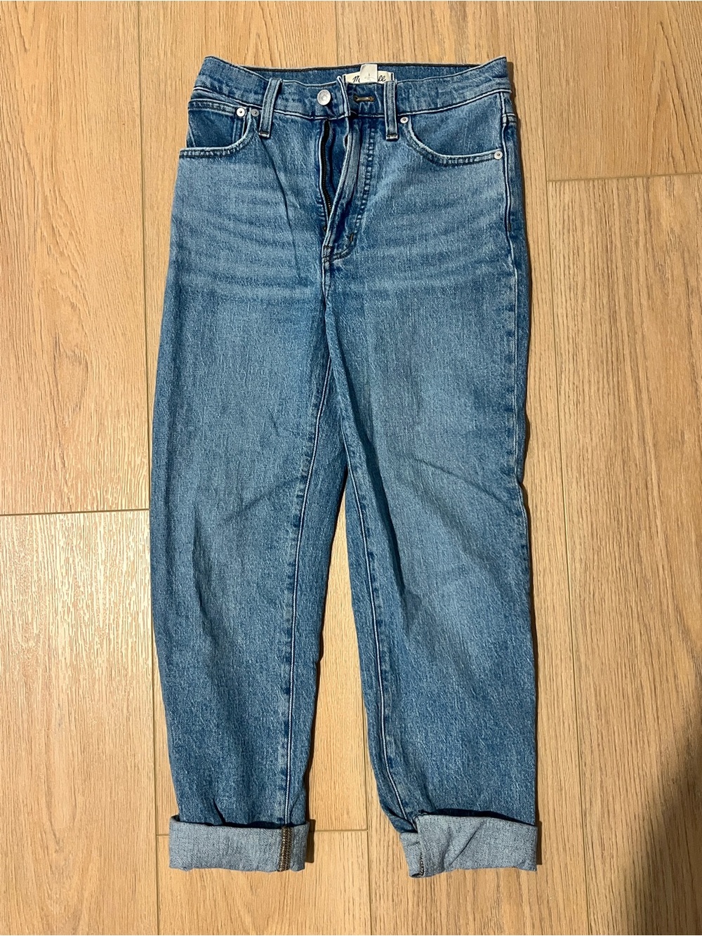 Madewell light blue denim jeans with brown leather patch